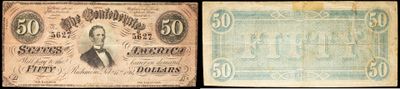 un ancien billet d'un dollar et un nouveau billet d'un dollar sur lesquels figure l'image d'un oiseau