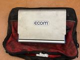 a laptop sitting on top of a bag on the floor