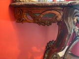 a wooden table with a mirror on top of it