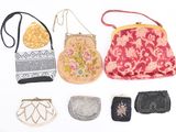 many different purses that are on a white surface
