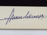 an autograph of a man with a signature on a piece of paper