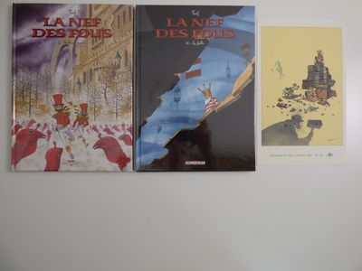 trois livres qui sont accrochés au mur les uns à côté des autres