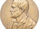 an image of a close up of a coin with a man ' s face on it