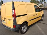 a small yellow van parked in a parking lot