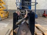 a forklift that is sitting on a pallet in a warehouse