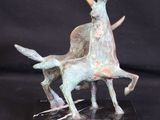 statue of a goat and a goat on a marble base