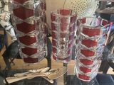 a glass table with a bunch of glasses on top of it