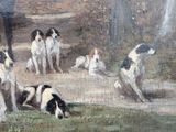 many dogs that are sitting in the dirt
