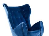 the blue chair is sitting on a white surface with a white background