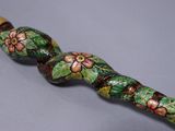 an image of a close up of a wooden stick with flowers on it