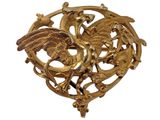 an image of a gold brooch with a bird on it ' s back