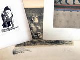 several drawings of animals and birds are on a table
