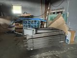 several pieces of metal are stacked up in a room
