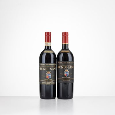 two bottles of red wine sitting on top of a table