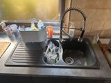 a sink that has a lot of dirty dishes in it