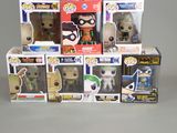 a bunch of pop vinyl figures in a display case