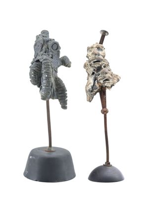 two figurines of a man and a woman on a white background