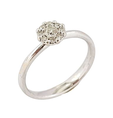 a close up of a diamond ring on a white background
