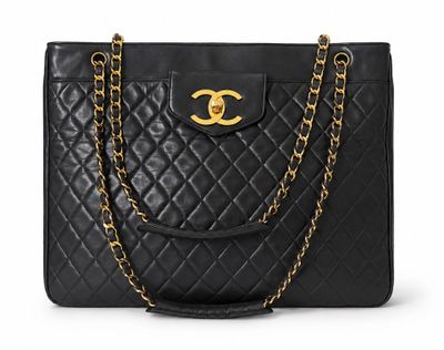 a chanel black quilted leather tote bag with gold hardware