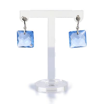 a pair of earrings with blue crystals hanging from them
