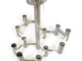 a silver metal candle holder with six candles on it