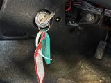 a car dashboard with a key in the middle of it