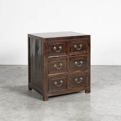 an antique chest of drawers with brass handles and drawers