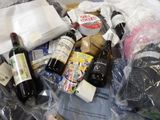 many bottles of wine and other items in a plastic bag