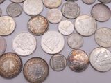 a lot of coins that are sitting on a table