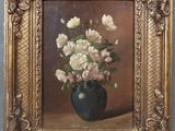 painting of flowers in a vase on a table in a gold frame