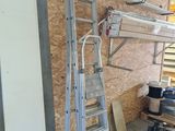 a ladder that is leaning against a wall in a garage