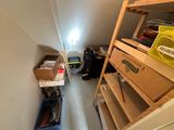 an image of a narrow room with a lot of boxes