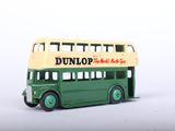 a green and yellow double decker bus on a white surface