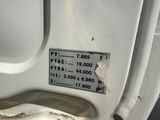 a close up of a white toilet with a sticker on it