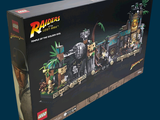 a box with a lego set in it on a blue background