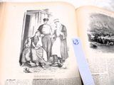 un livre ouvert sur lequel figure l'image d'un homme et de deux enfants