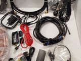 a box with a bunch of cables and other items