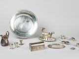 a lot of silver items that are on the table