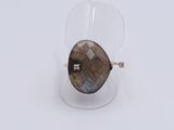 a close up of a ring with a brown stone on it