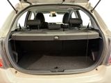 the back end of a car with the trunk open and the seats down