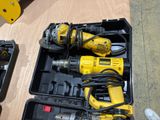 two electric tools in the case on the table