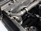 a close up of the engine of a car with its hood open