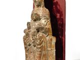 statue of a woman holding a child and a child in her lap