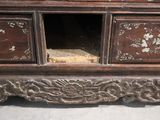 a wooden cabinet with drawers and a mirror on it