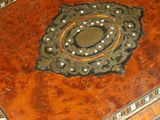 a wooden box with a decorative design on it