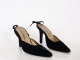 pair of black sued shoes with a bow on the heel