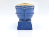a small blue bowl with a gold lid on a white surface
