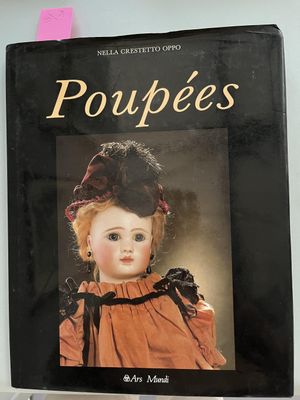 book titled poupee ' s, with a picture of a doll wearing a hat