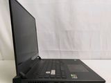 a black laptop computer sitting on a white surface