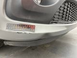 a close up of a car ' s grille with a sticker on it